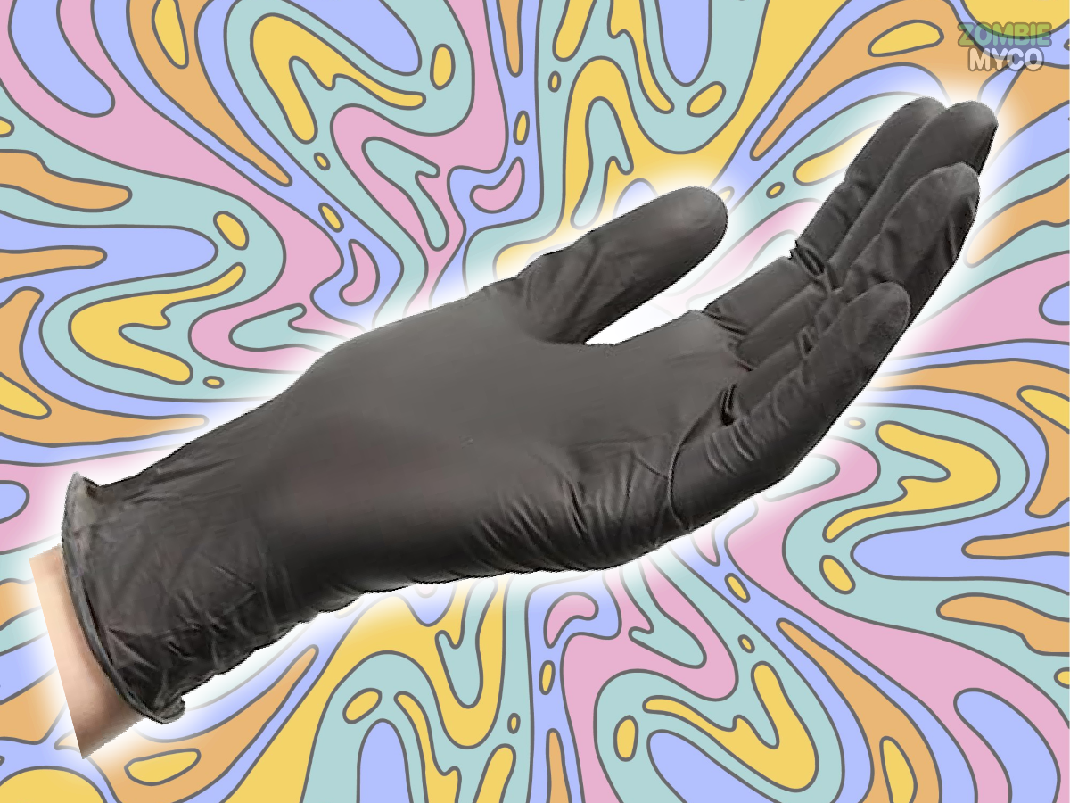 an image of a hand wearing the 4 Mil Black Nitrile Gloves